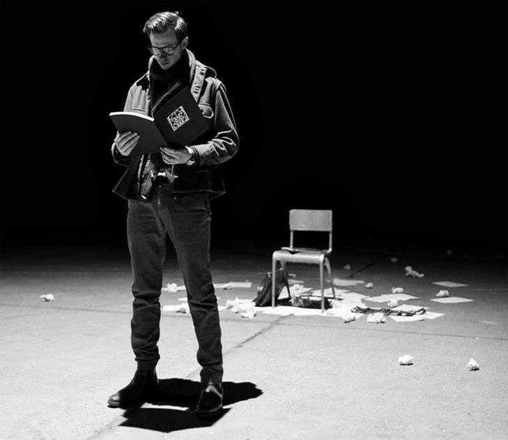 xfilm standing with book